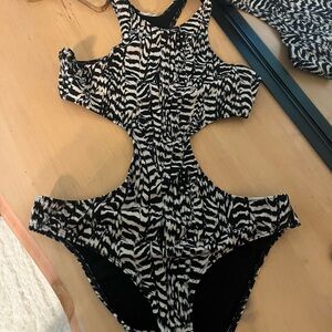 Out from Under One Piece Swimsuit sexy with some coverage